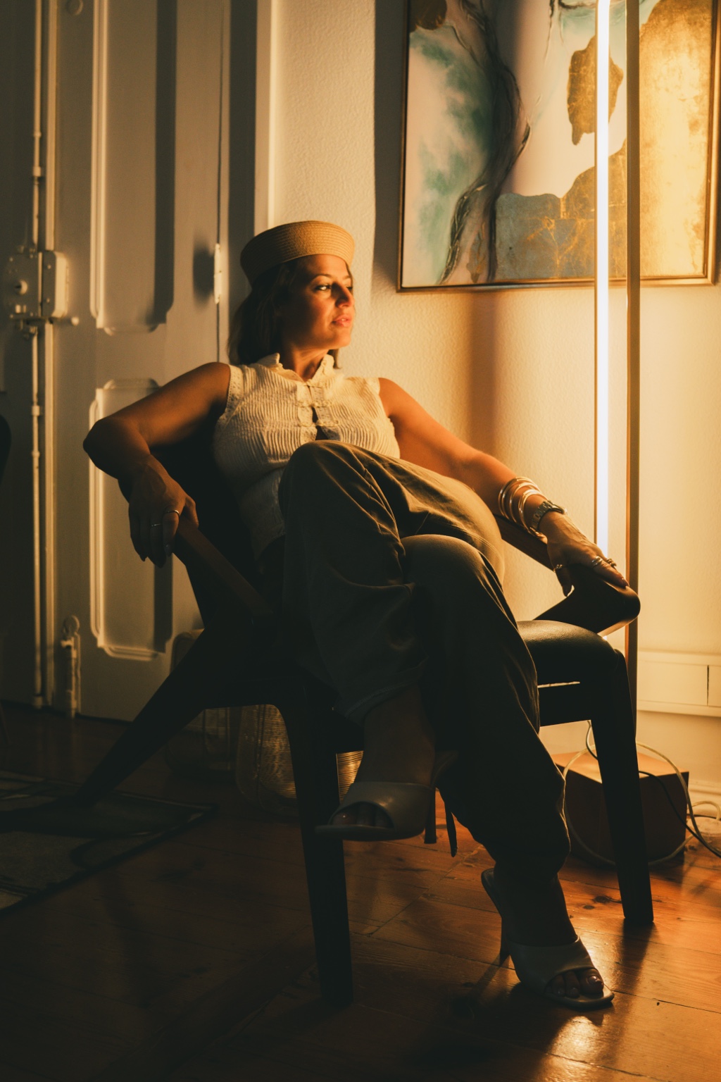 Christina seated in warm golden light