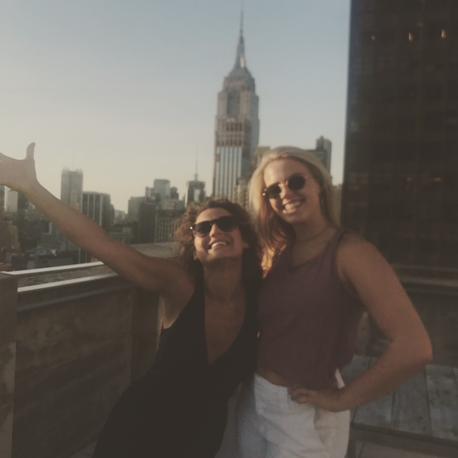 Christina with Reneé Rapp on a New York rooftop in 2018
