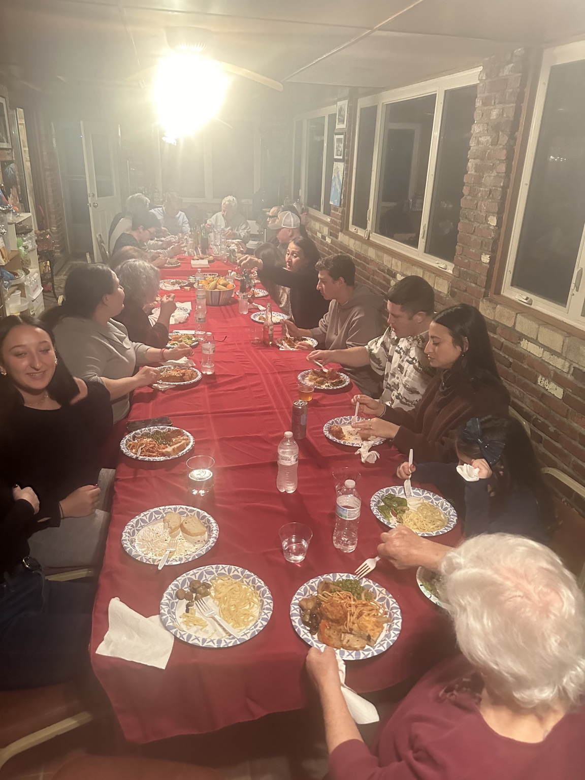 Guests gathered around a long table for dinner
